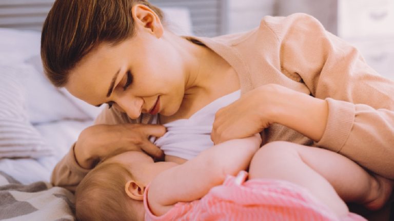 How does breastfeeding help reduce breast cancer risk?